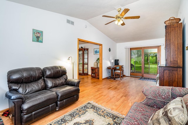 324 7th St NE, New Prague, MN 56071 - living room featuring vaulted ceiling, wood finished floors, and ceiling fan