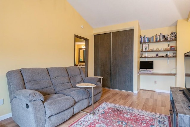 811 Smetana Rd Unit 8, Hopkins, MN 55343 - living room with light wood finished floors, vaulted ceiling, and baseboards
