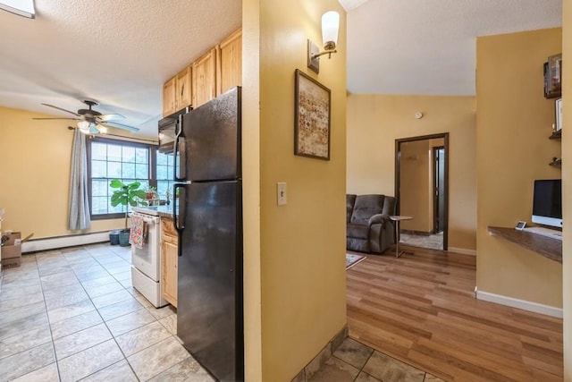 811 Smetana Rd Unit 8, Hopkins, MN 55343 - kitchen with black appliances, a baseboard heating unit, ceiling fan, light brown cabinetry, and light tile patterned floors