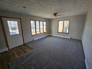 405 16th Ave NE, Waseca, MN 56093 - spare room with plenty of natural light, ceiling fan, and baseboards
