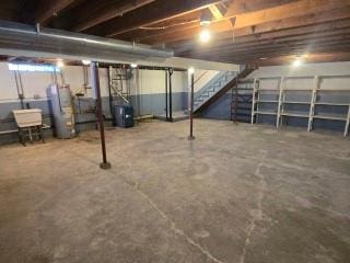 405 16th Ave NE, Waseca, MN 56093 - unfinished basement with water heater and stairway