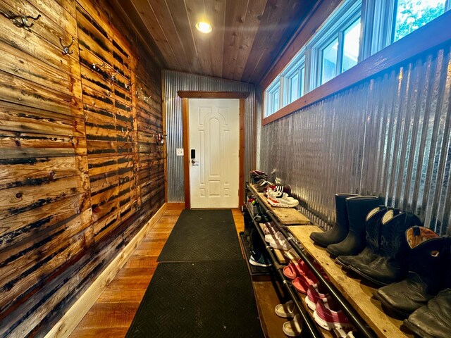 40580 Bow Trl, Nerstrand, MN 55053 - hall with wood finished floors, wood ceiling, and wooden walls
