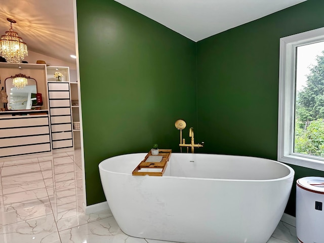 40580 Bow Trl, Nerstrand, MN 55053 - full bathroom with marble finish floors, a soaking tub, a chandelier, and vaulted ceiling