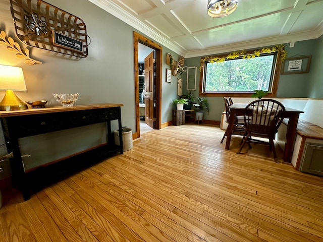 40580 Bow Trl, Nerstrand, MN 55053 - dining space featuring crown molding, light wood finished floors, and coffered ceiling