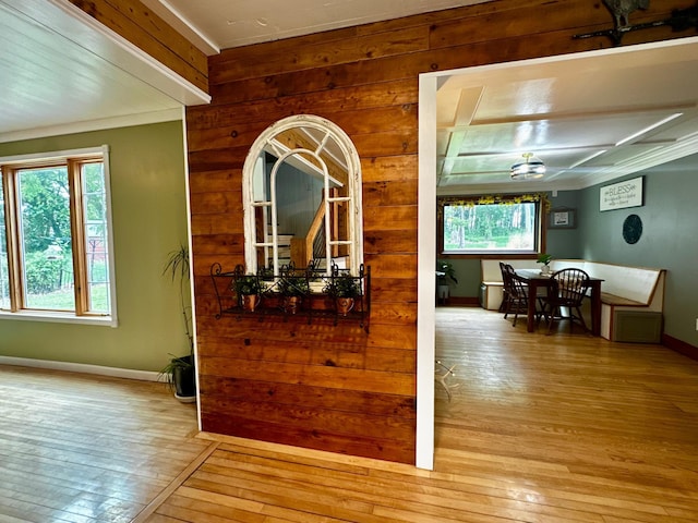 40580 Bow Trl, Nerstrand, MN 55053 - hallway featuring hardwood / wood-style floors, plenty of natural light, wooden walls, and crown molding