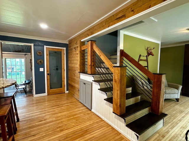 40580 Bow Trl, Nerstrand, MN 55053 - stairs featuring crown molding, wood-type flooring, and wood walls