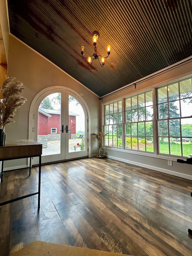 40580 Bow Trl, Nerstrand, MN 55053 - unfurnished sunroom with french doors, lofted ceiling, a chandelier, and arched walkways