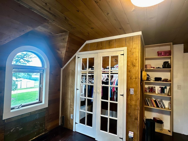 40580 Bow Trl, Nerstrand, MN 55053 - doorway with wood ceiling, lofted ceiling, wood walls, and dark wood-style flooring