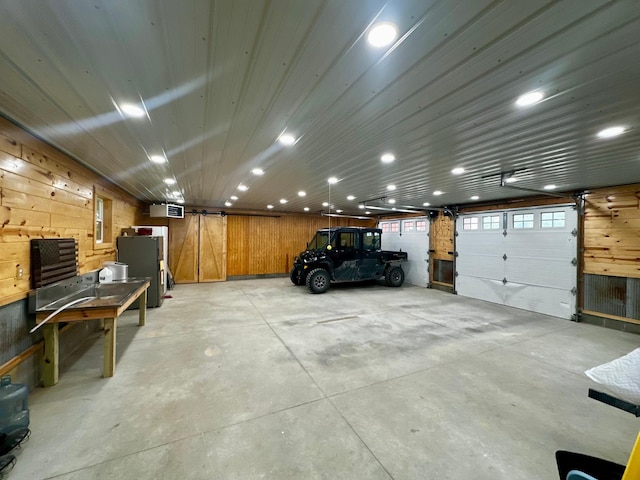 40580 Bow Trl, Nerstrand, MN 55053 - garage with wooden walls and recessed lighting