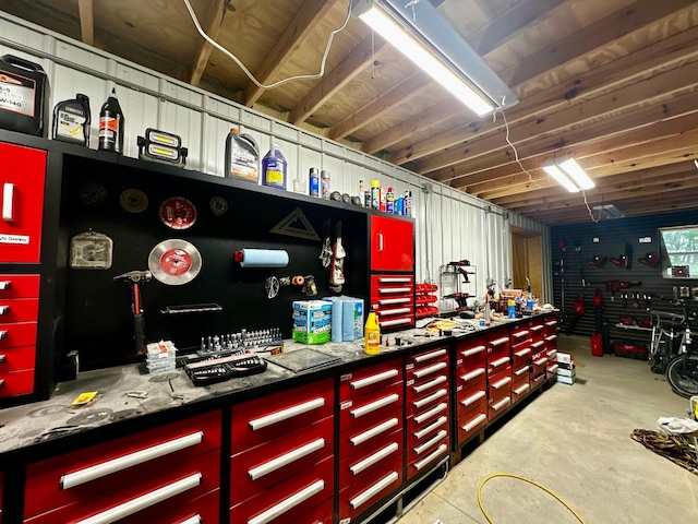 40580 Bow Trl, Nerstrand, MN 55053 - miscellaneous room featuring a workshop area and concrete flooring