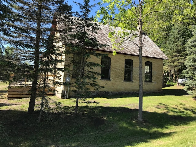 35379 215th Ave, Eagle Valley Twp, MN 56440 - view of property exterior with brick siding and a lawn