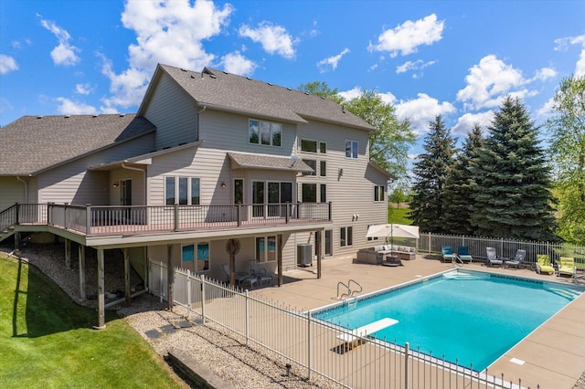 27285 Cambodia Ave, Castle Rock Twp, MN 55024 - rear view of property featuring a patio area, a shingled roof, a wooden deck, and an outdoor hangout area