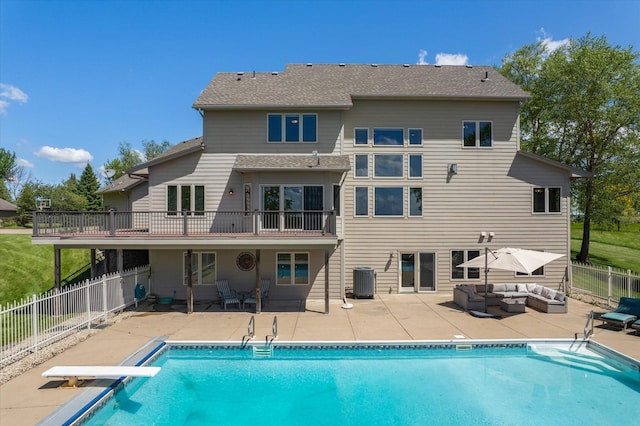 27285 Cambodia Ave, Castle Rock Twp, MN 55024 - rear view of house with outdoor lounge area, a patio, and central AC unit