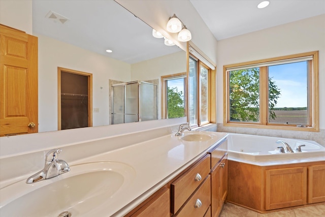 27285 Cambodia Ave, Castle Rock Twp, MN 55024 - full bathroom with a stall shower, double vanity, a jetted tub, recessed lighting, and a spacious closet