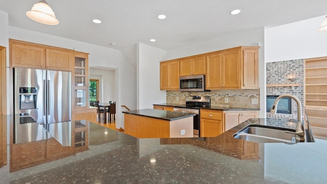 27285 Cambodia Ave, Castle Rock Twp, MN 55024 - kitchen with appliances with stainless steel finishes, a sink, backsplash, dark stone countertops, and recessed lighting