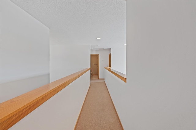 27285 Cambodia Ave, Castle Rock Twp, MN 55024 - corridor featuring light carpet, an upstairs landing, and recessed lighting