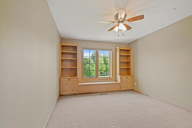 27285 Cambodia Ave, Castle Rock Twp, MN 55024 - unfurnished room featuring a textured ceiling, ceiling fan, light carpet, and baseboards