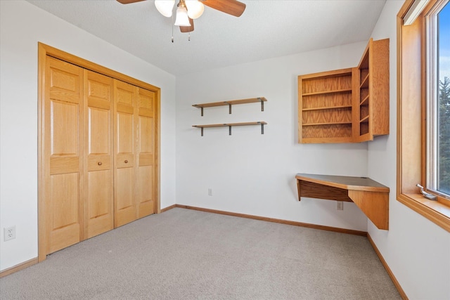 27285 Cambodia Ave, Castle Rock Twp, MN 55024 - unfurnished bedroom with carpet floors, baseboards, ceiling fan, and a closet