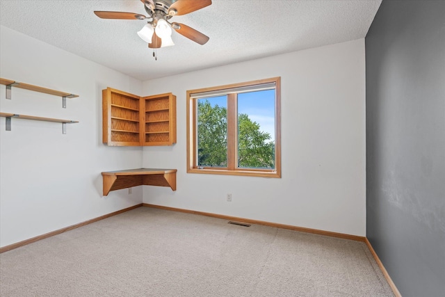 27285 Cambodia Ave, Castle Rock Twp, MN 55024 - unfurnished room with carpet flooring, a textured ceiling, ceiling fan, and baseboards
