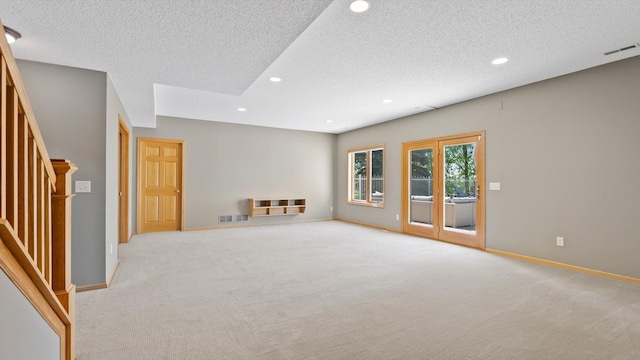 27285 Cambodia Ave, Castle Rock Twp, MN 55024 - spare room with light carpet, recessed lighting, a textured ceiling, stairway, and baseboards