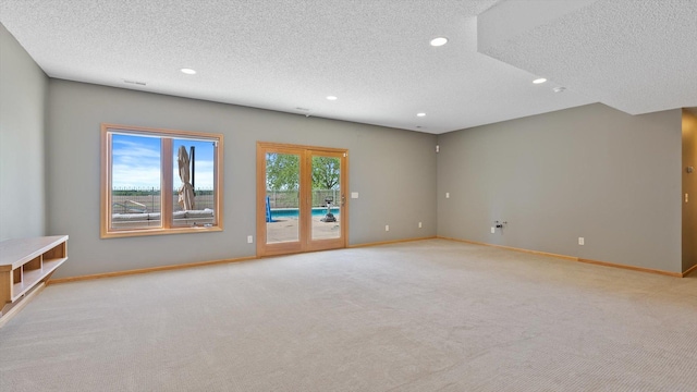 27285 Cambodia Ave, Castle Rock Twp, MN 55024 - unfurnished room featuring a textured ceiling, recessed lighting, carpet flooring, and baseboards
