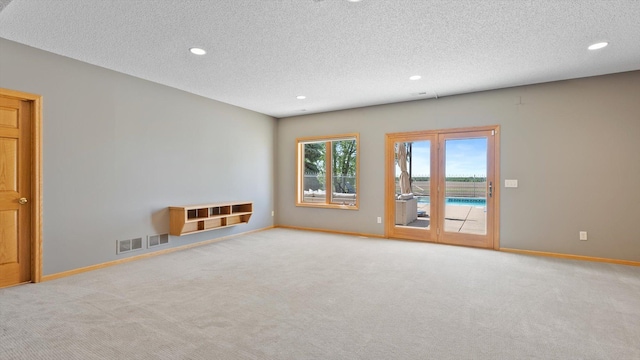 27285 Cambodia Ave, Castle Rock Twp, MN 55024 - unfurnished room featuring carpet floors, recessed lighting, baseboards, and a textured ceiling
