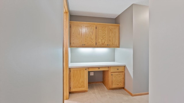 27285 Cambodia Ave, Castle Rock Twp, MN 55024 - unfurnished office featuring light colored carpet, built in study area, and baseboards