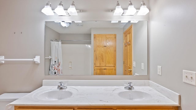 27285 Cambodia Ave, Castle Rock Twp, MN 55024 - bathroom with double vanity, toilet, and a shower with shower curtain