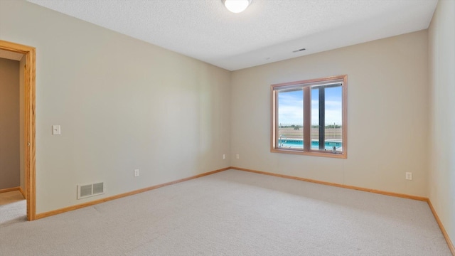27285 Cambodia Ave, Castle Rock Twp, MN 55024 - carpeted spare room featuring baseboards and a textured ceiling
