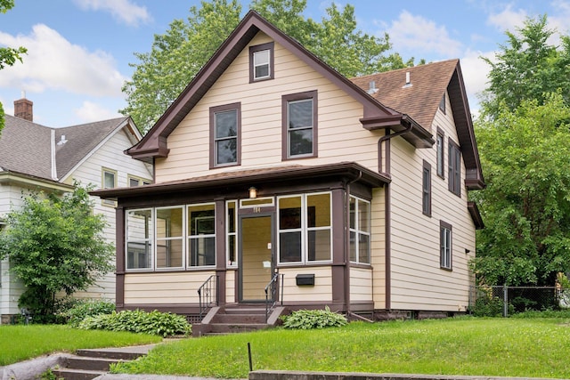 884 Thomas Ave, Saint Paul, MN 55104 - view of front of house with roof with shingles and a sunroom