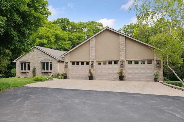 1405 Farm Rd, Chanhassen, MN 55318 - mid-century inspired home with an attached garage, driveway, stucco siding, and brick siding