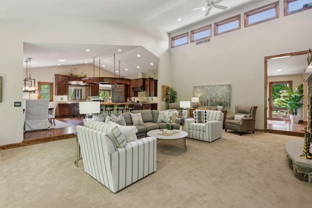 1405 Farm Rd, Chanhassen, MN 55318 - living area with light carpet, plenty of natural light, recessed lighting, a ceiling fan, and high vaulted ceiling