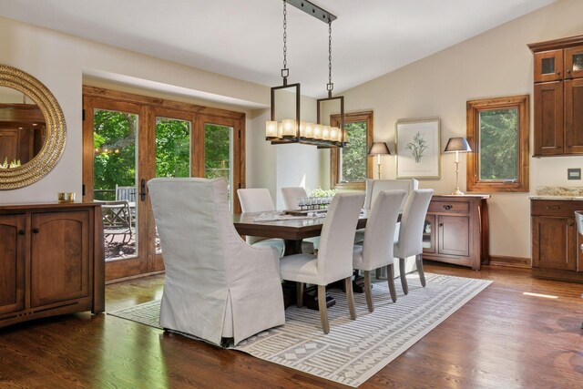 1405 Farm Rd, Chanhassen, MN 55318 - dining space with lofted ceiling, a chandelier, dark wood finished floors, and baseboards