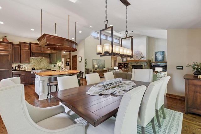 1405 Farm Rd, Chanhassen, MN 55318 - dining area with lofted ceiling, dark wood-style flooring, recessed lighting, baseboards, and a chandelier