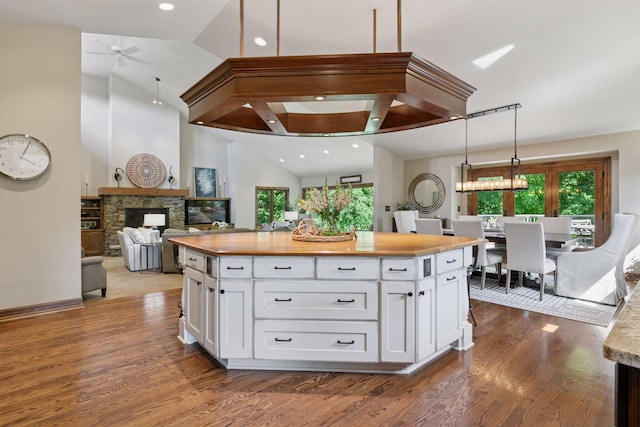1405 Farm Rd, Chanhassen, MN 55318 - kitchen with butcher block countertops, a ceiling fan, white cabinets, dark wood finished floors, and recessed lighting