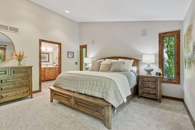 1405 Farm Rd, Chanhassen, MN 55318 - bedroom featuring light colored carpet, baseboards, ensuite bath, and high vaulted ceiling