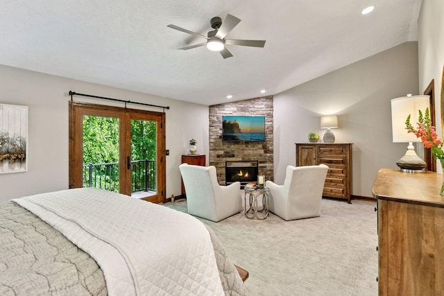 1405 Farm Rd, Chanhassen, MN 55318 - bedroom featuring vaulted ceiling, access to exterior, light colored carpet, a stone fireplace, and recessed lighting
