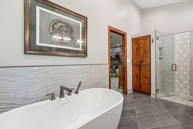 1405 Farm Rd, Chanhassen, MN 55318 - bathroom featuring a freestanding tub, a stall shower, and tile patterned flooring