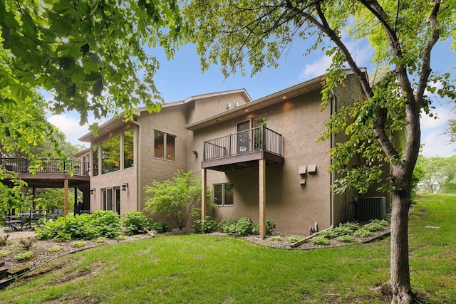 1405 Farm Rd, Chanhassen, MN 55318 - back of property featuring a balcony, a lawn, stucco siding, central air condition unit, and a patio area