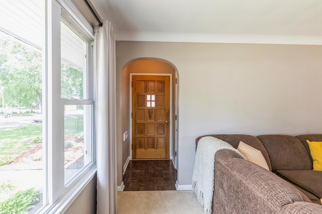 613 9th St NW, Faribault, MN 55021 - doorway to outside with arched walkways, healthy amount of natural light, and baseboards