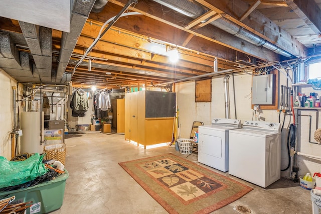 613 9th St NW, Faribault, MN 55021 - below grade area featuring washer and clothes dryer, electric panel, gas water heater, and heating unit