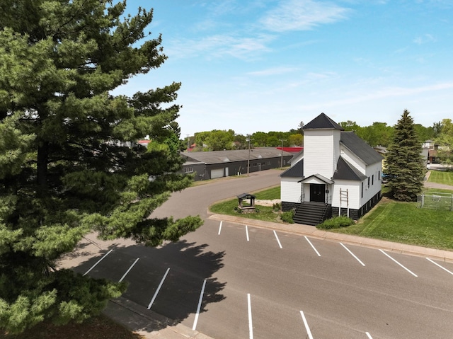 324 Douglas St, Chetek, WI 54728 - uncovered parking lot with view of scattered trees