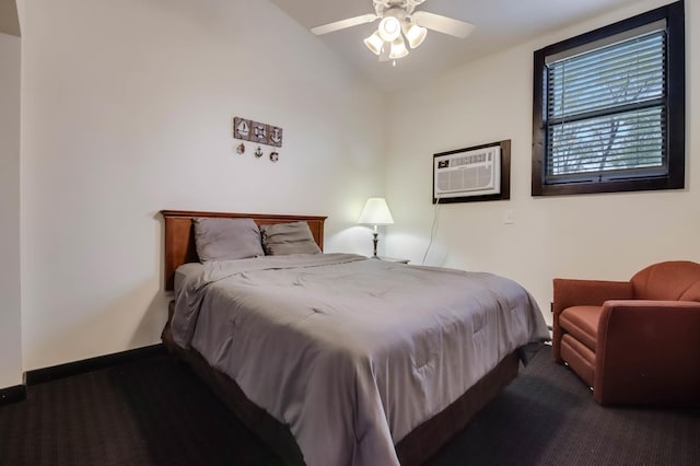 324 Douglas St, Chetek, WI 54728 - carpeted bedroom featuring baseboards, a wall unit AC, vaulted ceiling, and ceiling fan