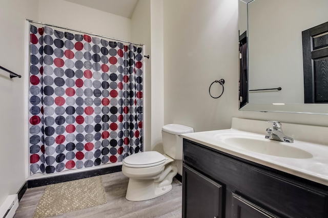 324 Douglas St, Chetek, WI 54728 - bathroom featuring a baseboard heating unit, vanity, toilet, wood finished floors, and curtained shower