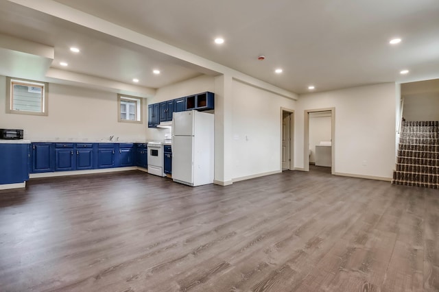 324 Douglas St, Chetek, WI 54728 - unfurnished living room with recessed lighting, wood finished floors, baseboards, and stairway