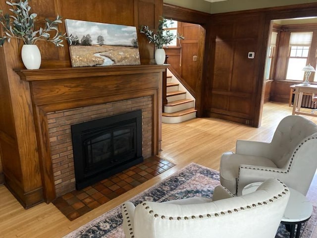 503 14th Ave SW, Rochester, MN 55902 - living room with light wood-style floors and a brick fireplace