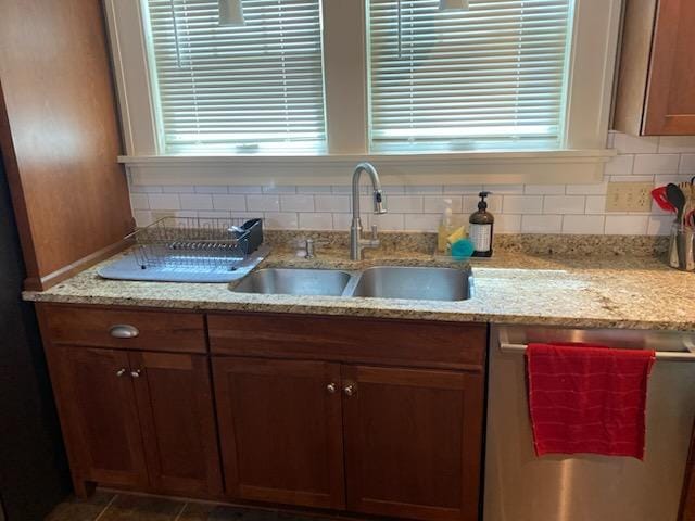 503 14th Ave SW, Rochester, MN 55902 - kitchen featuring dishwasher, a sink, tasteful backsplash, and light stone counters