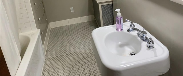 503 14th Ave SW, Rochester, MN 55902 - bathroom with a sink, a tub, and a shower with curtain