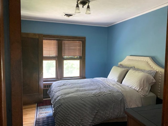 503 14th Ave SW, Rochester, MN 55902 - bedroom with wood finished floors and crown molding