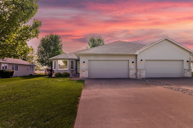 812 Chestnut St, Belle Plaine, MN 56011 - ranch-style house featuring a garage, concrete driveway, a lawn, and brick siding